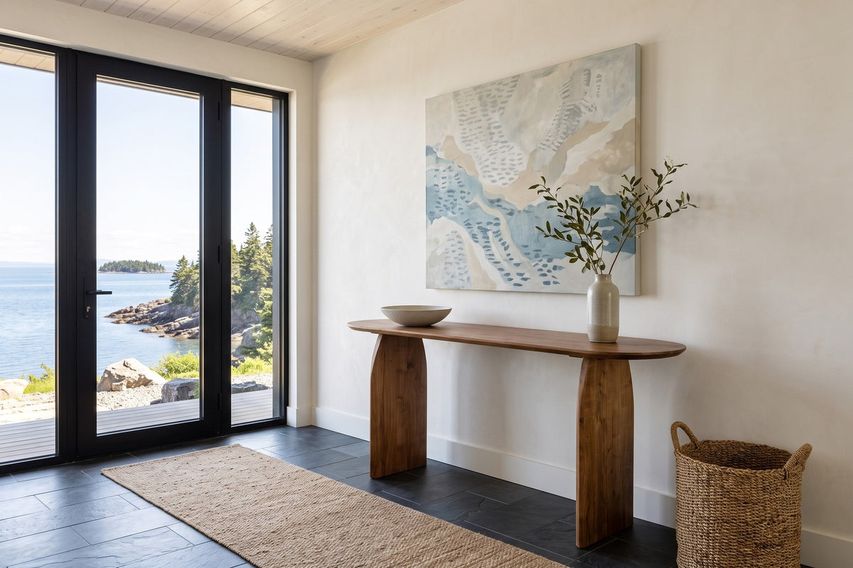 Visso console table in Pecan in the entrance hall of a house at Bic on the St. Lawrence, with warm white plaster