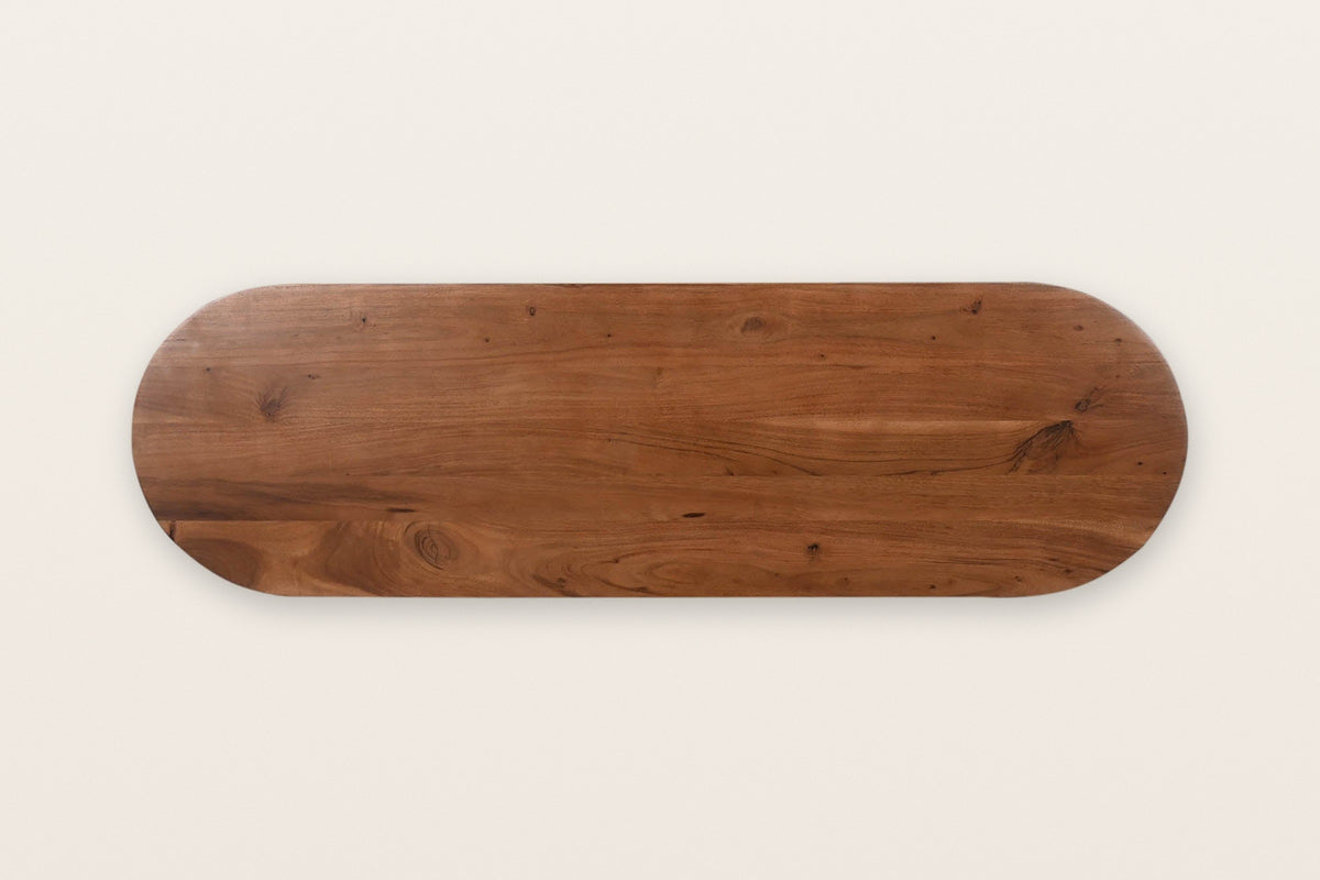 The Visso console top seen from above in Pecan: a long racetrack of solid acacia with round ends