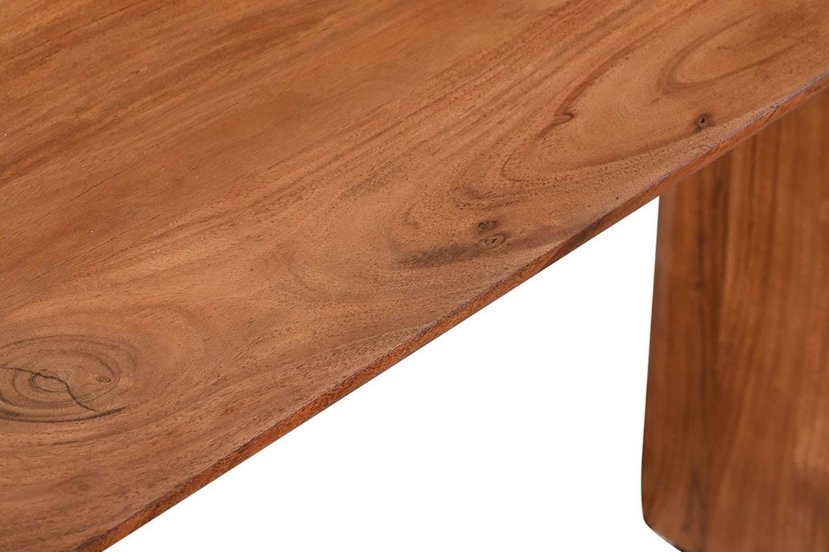 Close-up of the Visso console top in Pecan: acacia grain with a knot, the rounded edge and the end of a panel leg below