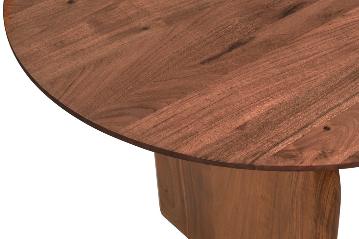 Close-up of a Visso round end in Pecan: acacia grain on the top, a slim edge, and the top of a panel leg below