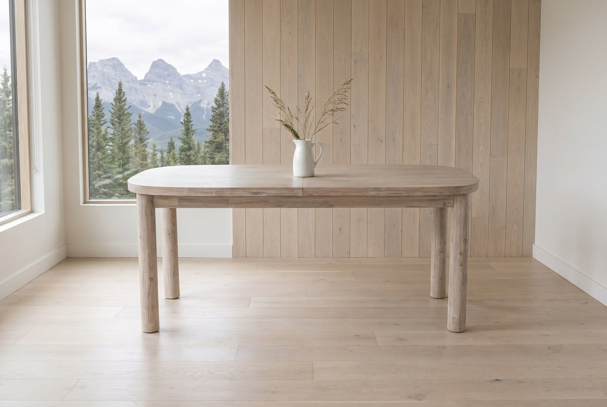 Vitorchiano dining table from the long side in a Canmore mountain house, the Three Sisters peaks through the window