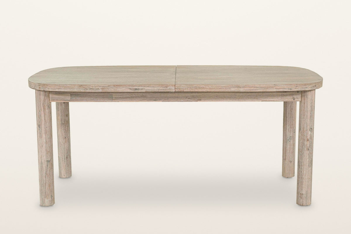 Vitorchiano dining table from the long side, closed: the rounded-rectangle top, the seam across the middle and four round legs