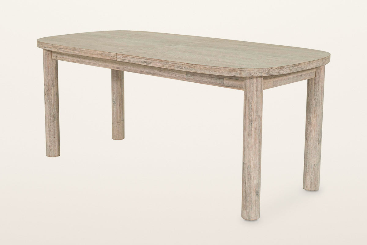 Vitorchiano extension dining table in Natural White Washed acacia, closed at 70 in, three-quarter view on a warm white studio backdrop
