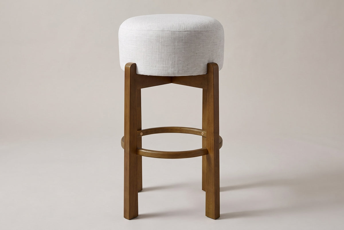 Vogogna bar stool in Dark Walnut, straight front view on a studio backdrop: four square legs
