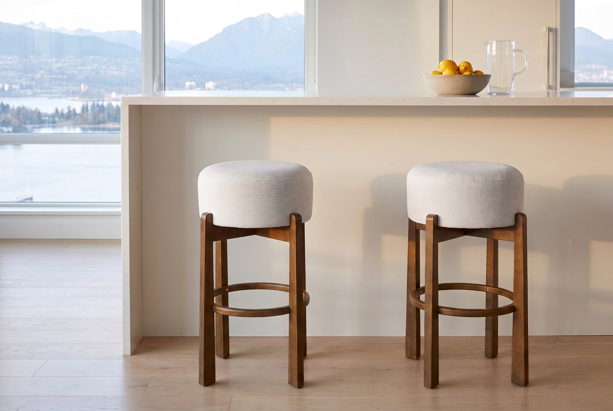 Two Dark Walnut Vogogna bar stools at a quartz kitchen island in a Vancouver condo with a harbour and mountain view