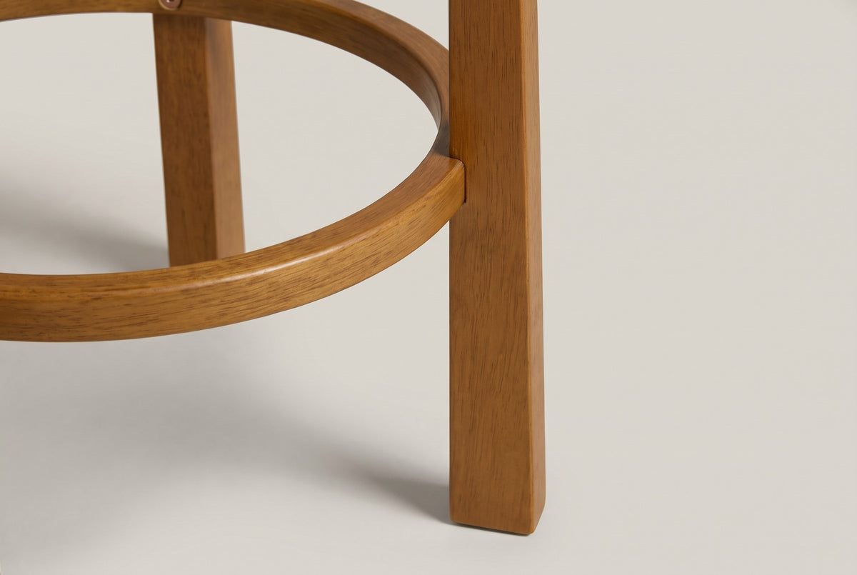 Close-up of the Vogogna round footring meeting a square Walnut leg