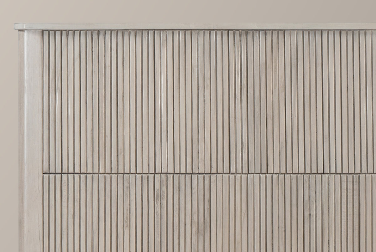 Close-up of the whitewashed beige Volterra headboard: the flat capped top rail