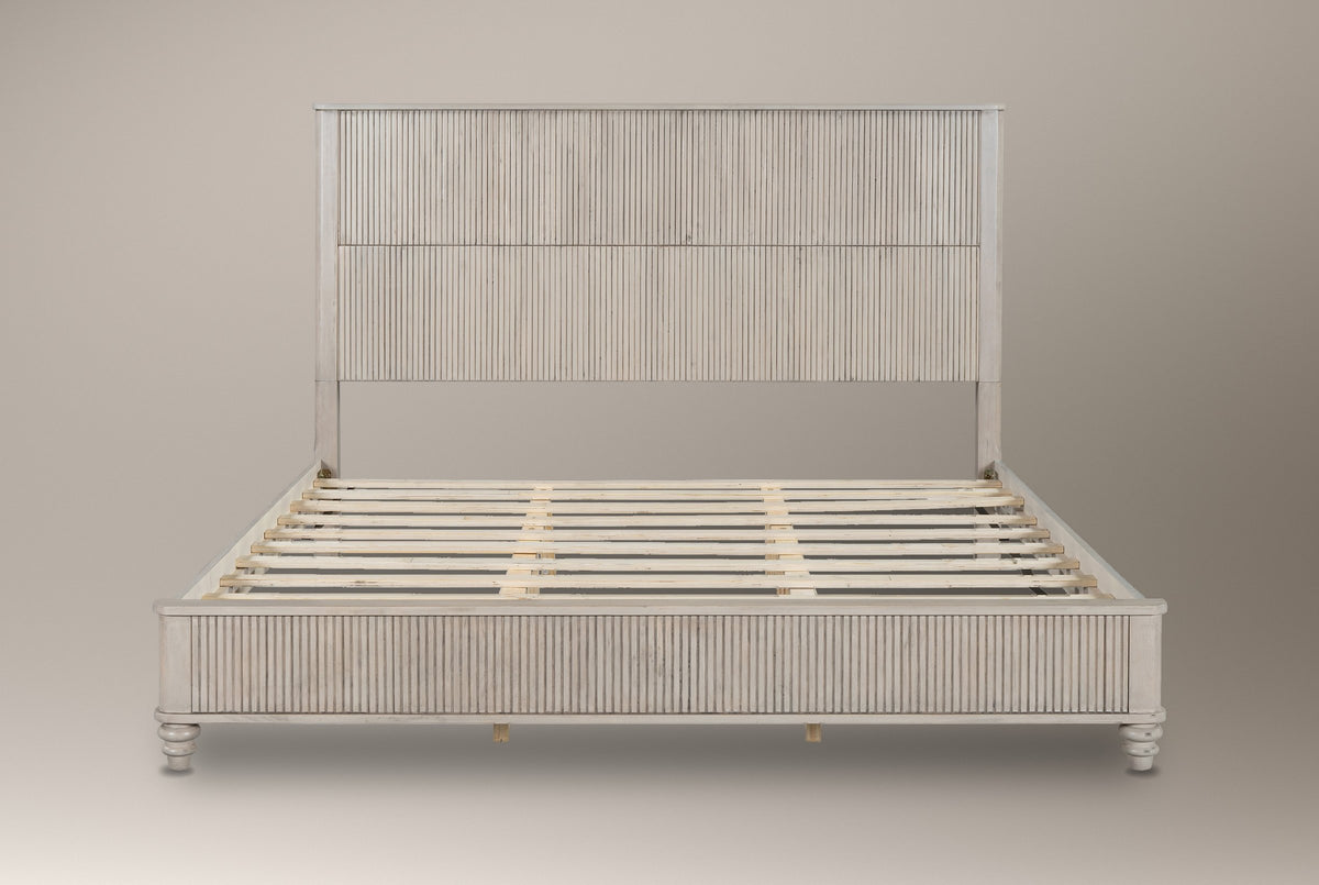 Volterra reeded bed in beige, straight front view of the bare frame and slats on a studio backdrop