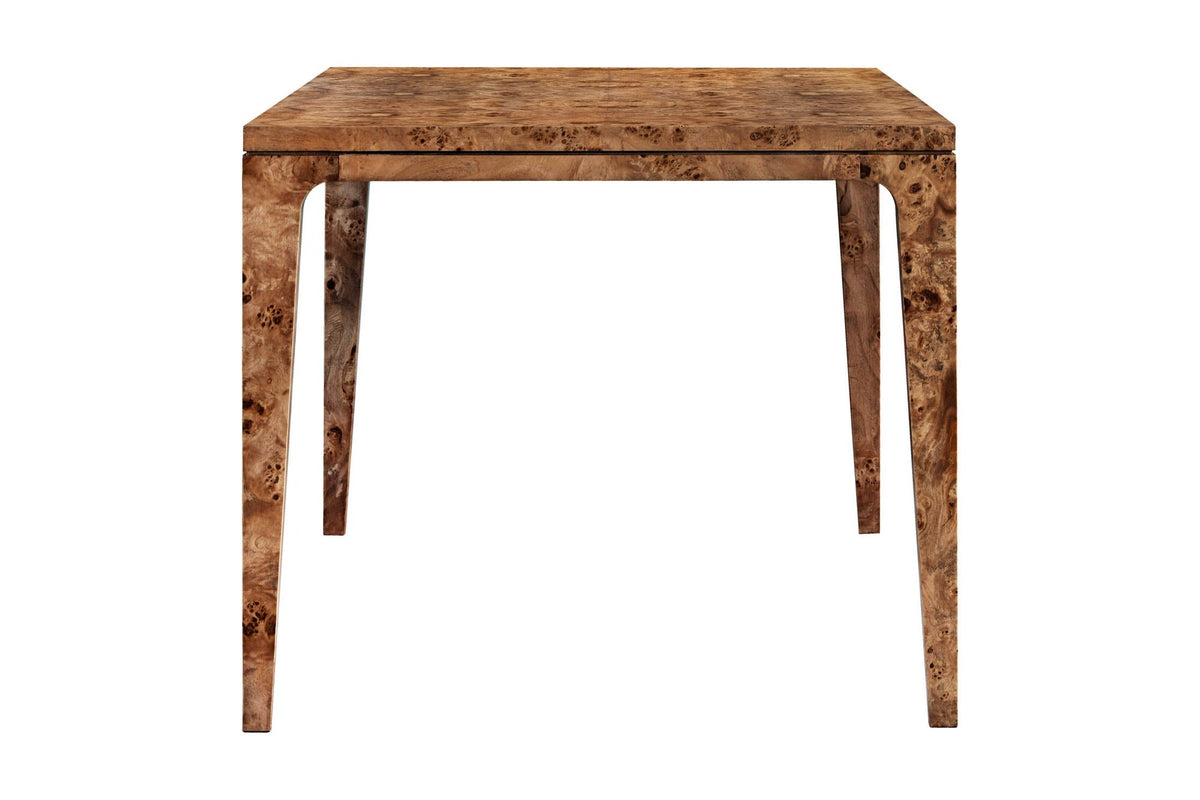 Winslow dining table end view showing the tapered legs and black accent line