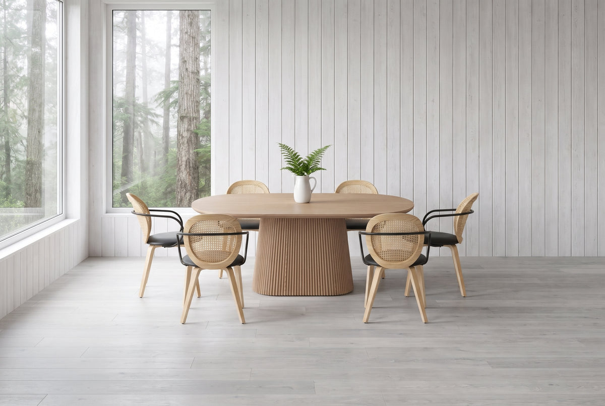 Yale 7-piece dining set in natural oak in a west-coast house near Tofino with whitewashed cedar walls and misty rainforest through the window