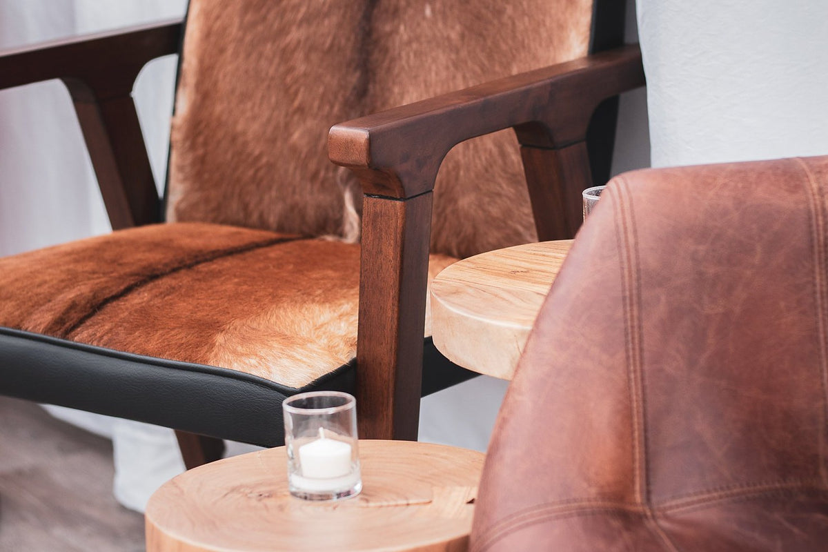 Yardley chair close-up of the mindi oak arm and hide-covered seat