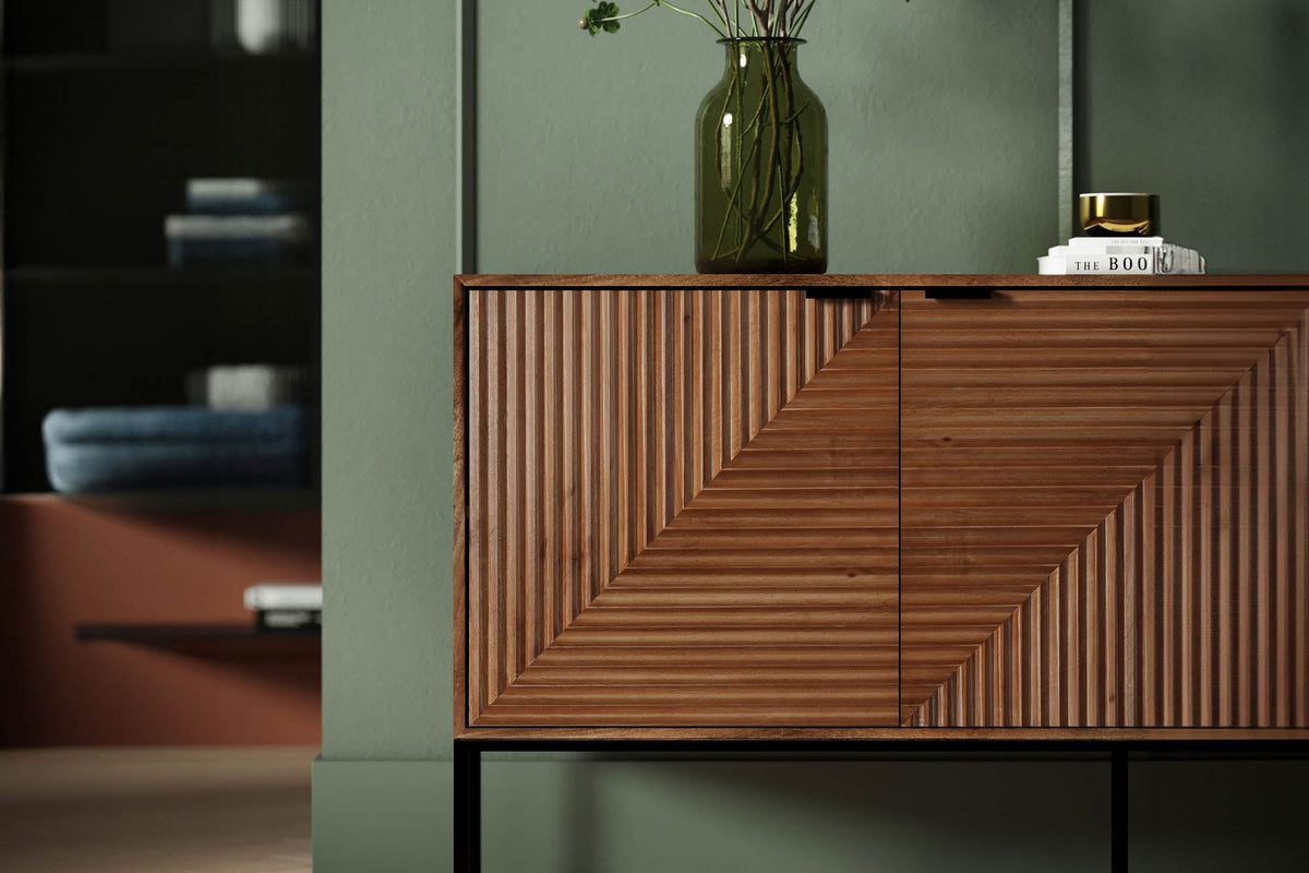 Zephyr pecan sideboard styled with a glass vase in a green dining room