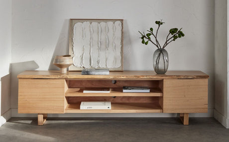 Valencia wood media console styled beneath a wall-mounted screen