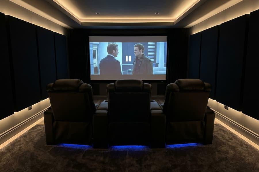 Valencia Tuscany home theater recliners in a dark dedicated cinema room with soft LED accent lighting