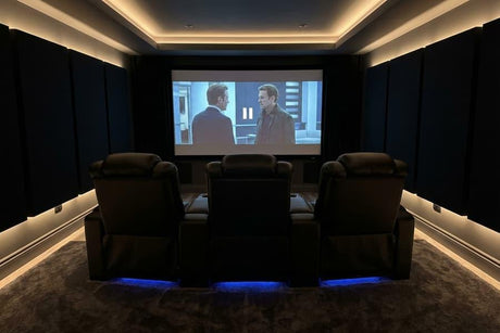 Valencia Tuscany home theater recliners in a dark dedicated cinema room with soft LED accent lighting