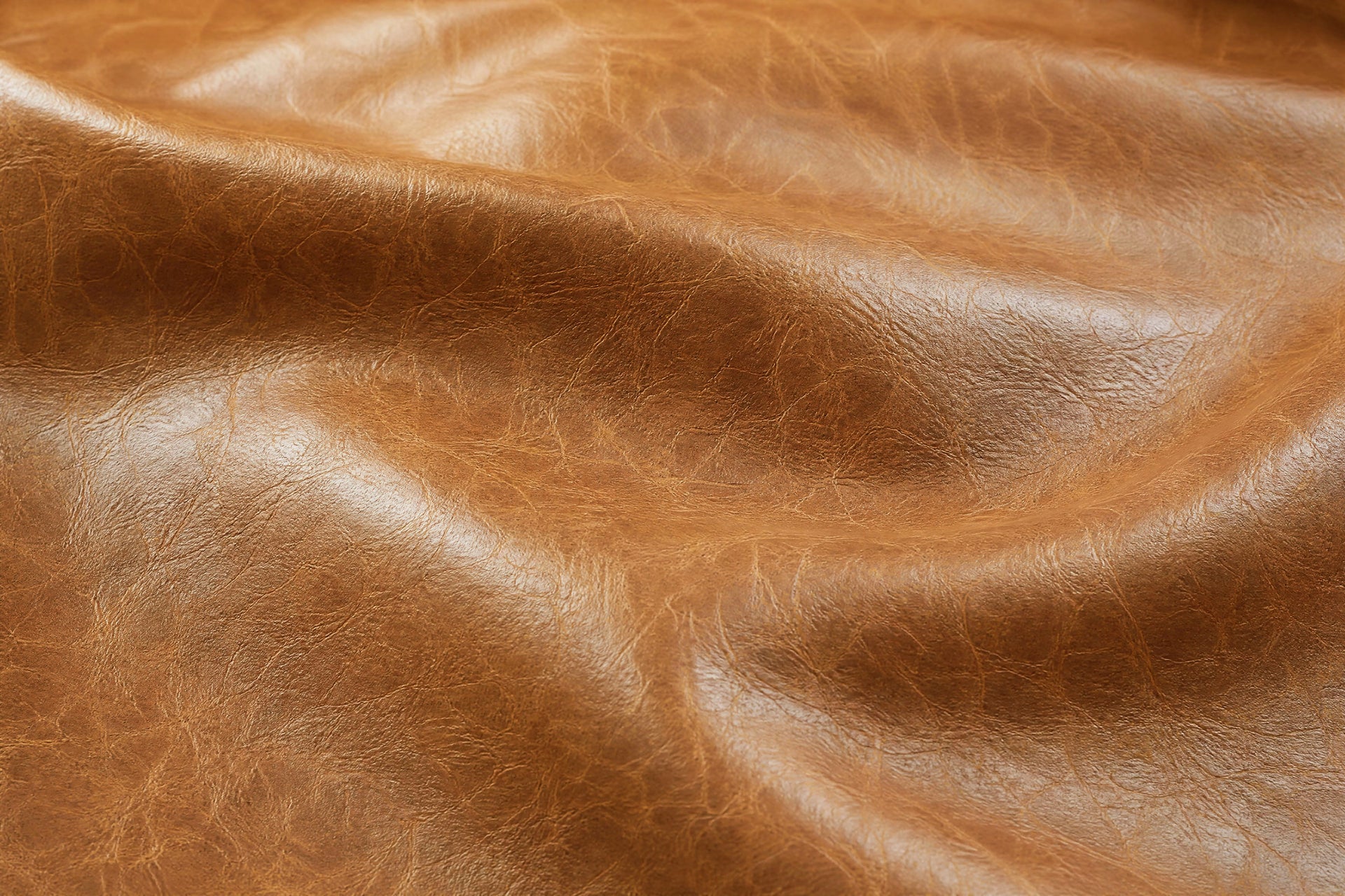 Close view of distressed leather and tailored stitching