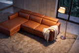 Overhead view of the Andria cognac leather sectional with left-facing chaise in a contemporary room