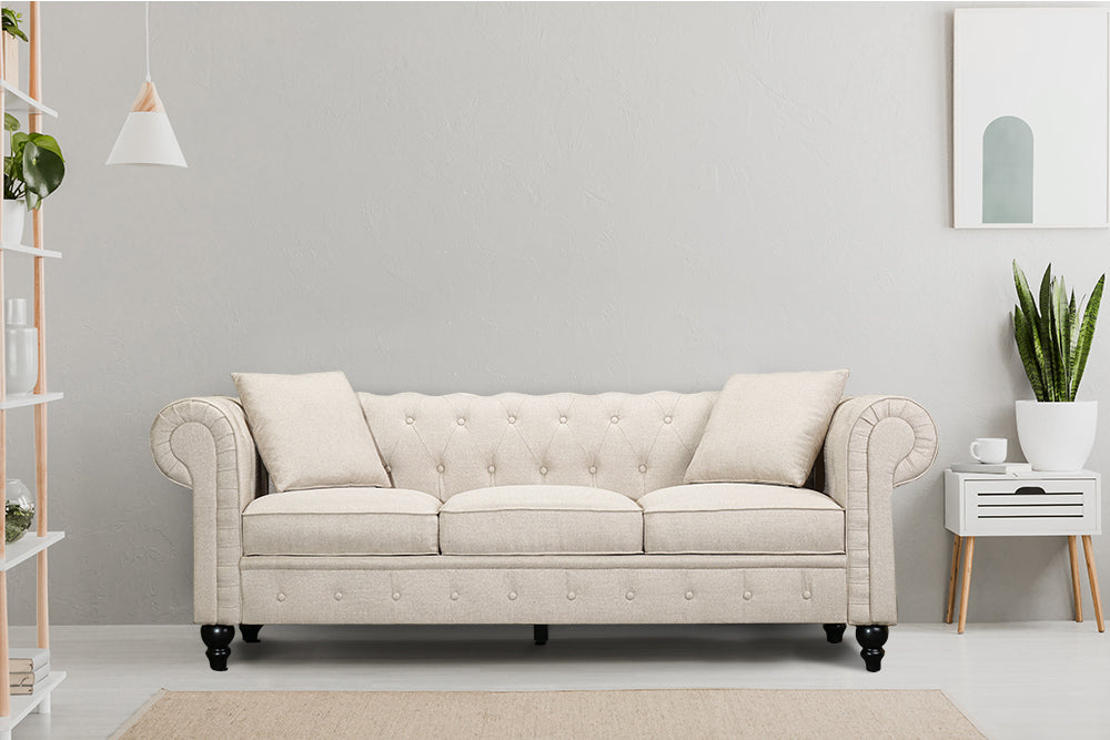 In Living Room, Straight Front View of A Classic, Beige, Three Seats, Cerna Chesterfield Fabric Sofa.