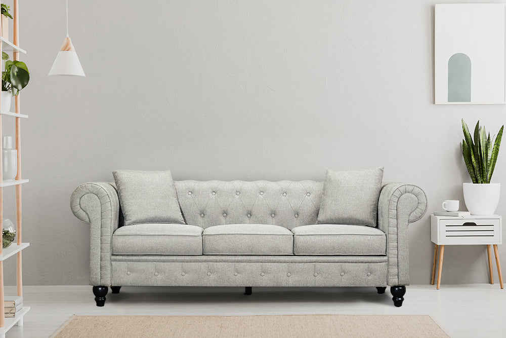 In Living Room, Straight Front View of A Classic, Light Grey, Three Seats, Cerna Chesterfield Fabric Sofa.