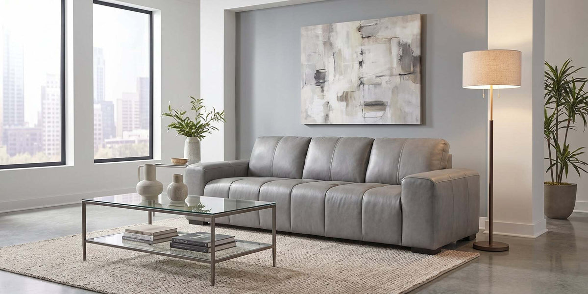 Elara grey leather sofa in a bright modern living room