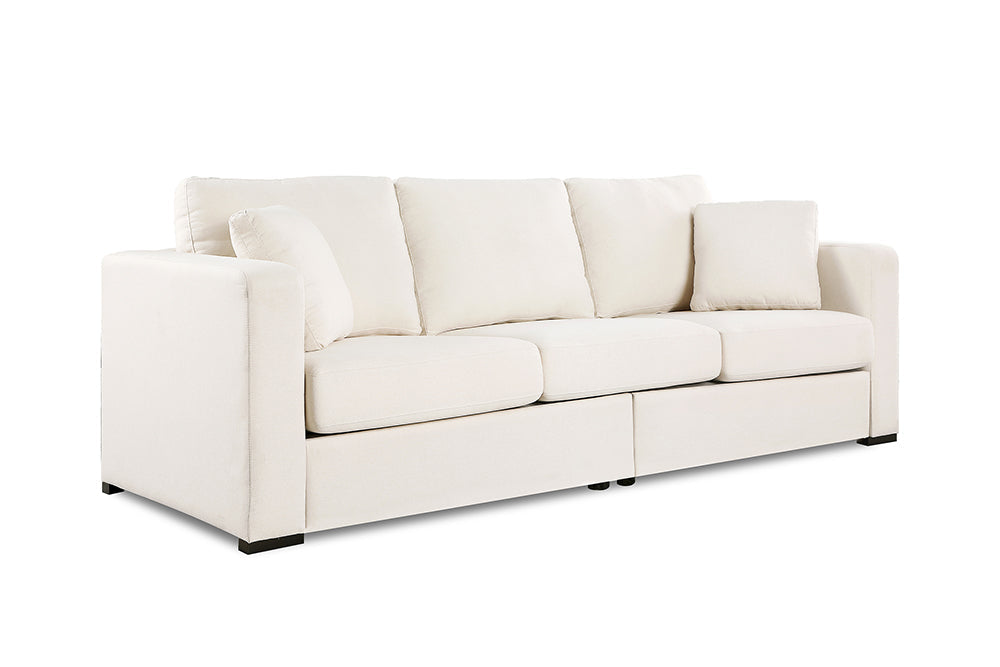 Left angled front view of a modern, beige, three-seat, eva modern fabric sofa with two side cushions.