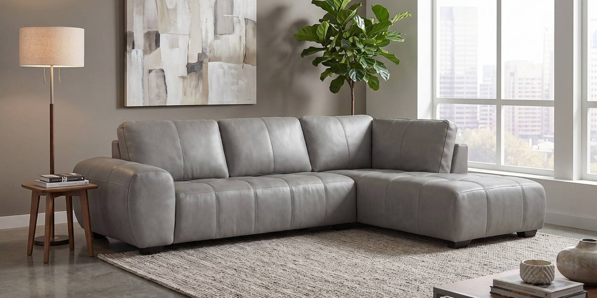 Evelina Grey leather sectional sofa in a contemporary city living room