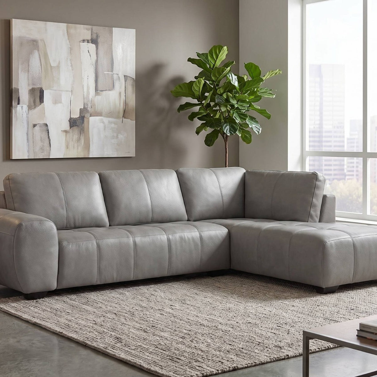 Evelina Grey leather sectional sofa in a contemporary city living room, mobile