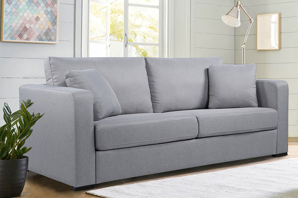 In a Living Room, There is Left Angled Front View of A Modern, Grey, Love-Seat, Harvard Modern Fabric Sofa with Two Side Cushions.
