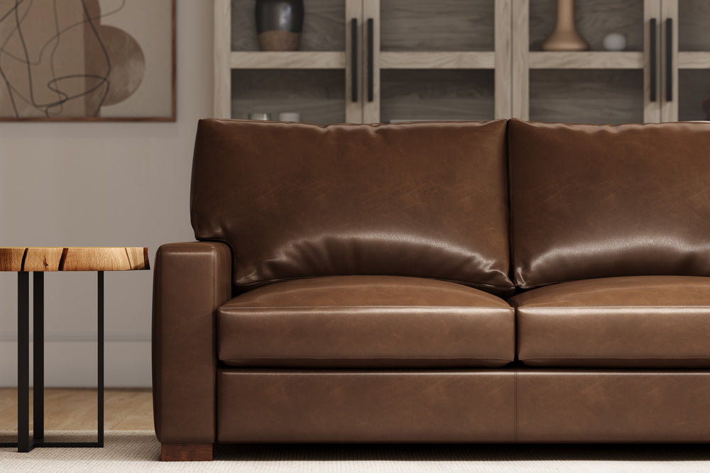 In a Living Room, There is Left-Side's Half Straight Front View of A Luxurious, Lipari Choco, Kiln Dried Wood Frame, Luton Leather Loveseats Sofa.