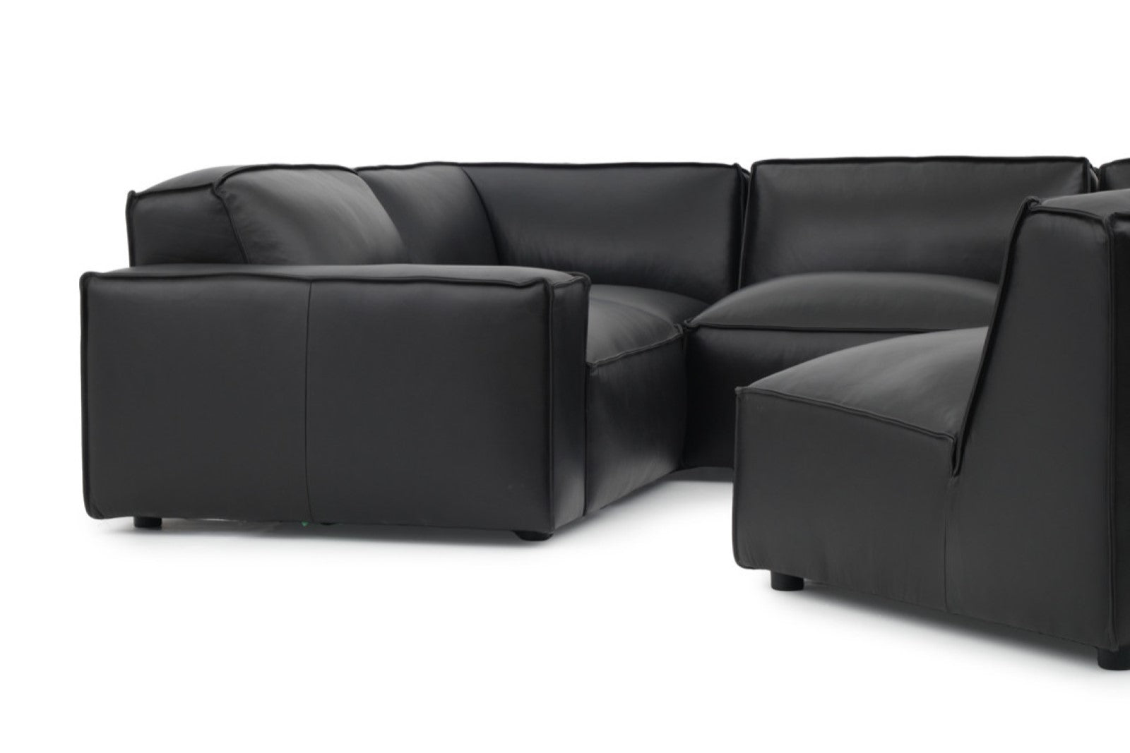 Left Angled Front Close-Up View of A Modern, Black, Four Seats, Full Aniline Top Grain Leather Modular Sofa with a Single Adjust Sofa on a White Background.