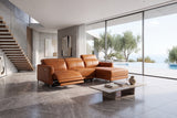 Andria cognac leather power reclining sectional in a modern room with the footrest extended