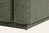 Close-up of the Abbadia base in moss: the channels end above a recessed upholstered plinth with a small foot at the corner