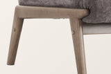 Close-up of the Acquasparta wood frame: the rounded end of the side rail under the seat