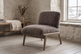 Acquasparta accent chair in dark taupe velvet in a Quebec City stone-house sitting room