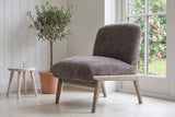Acquasparta accent chair in dark taupe velvet in a Victoria garden room with white panelling
