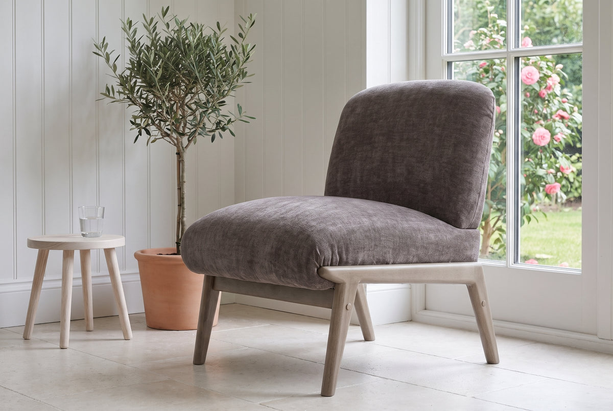 Acquasparta accent chair in dark taupe velvet in a Victoria garden room with white panelling