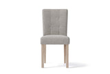 Adelina upholstered dining chair in light grey woven fabric with pale oak legs, seen from the front on a white background