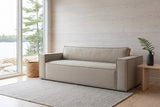 Agerola sofa in Sand in a whitewashed Muskoka cottage living room, the lake through the window