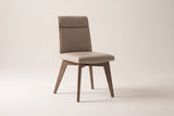 Aileen dining chair in beige leather with square, tapered ash legs on a studio backdrop, front three-quarter view