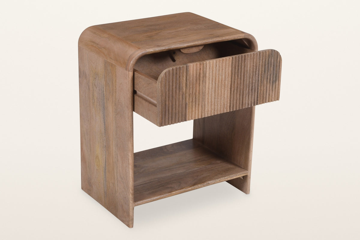 Alberona nightstand in natural with the reeded drawer open on its wood glides