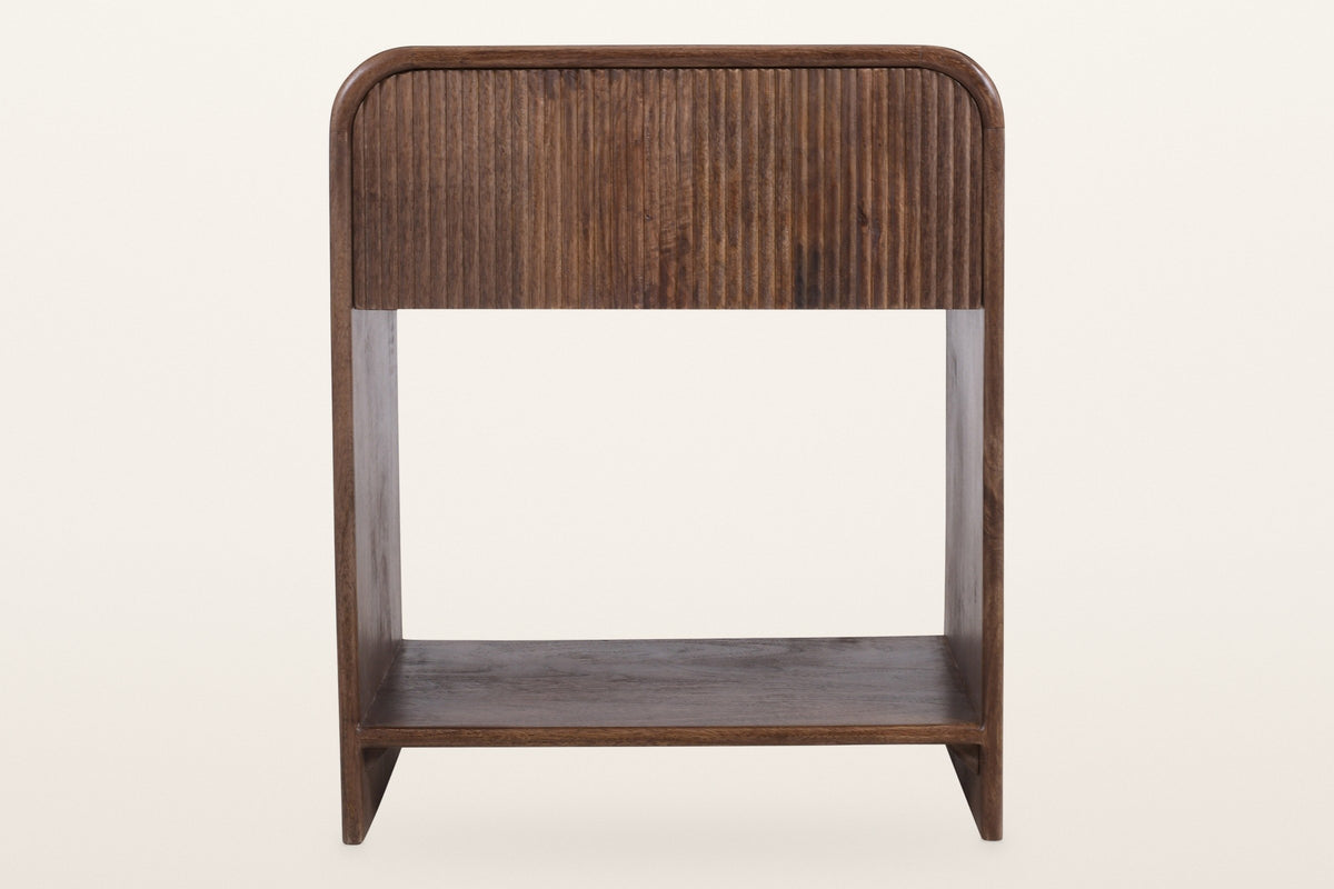 Alberona nightstand in walnut, straight front view: a reeded drawer under a top that bends down into the sides