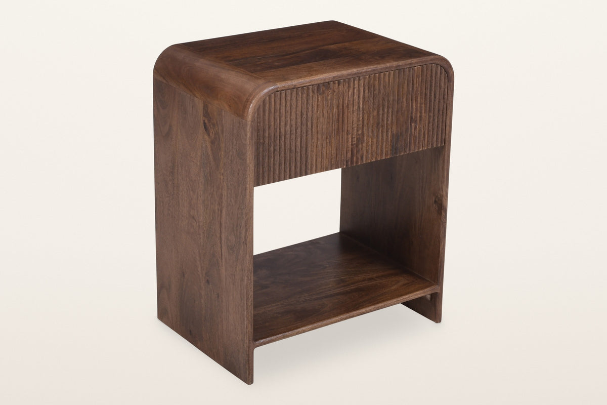 Alberona reeded mango wood nightstand in walnut, three-quarter view on a warm white studio backdrop