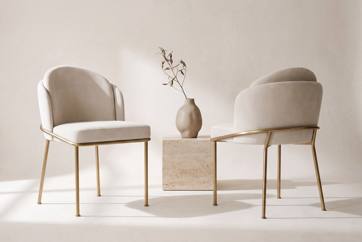 Two Alexander dining chairs, front and back views, beside a travertine block