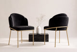 Two Alexander dining chairs in black velvet, front and back views, beside a black marble block