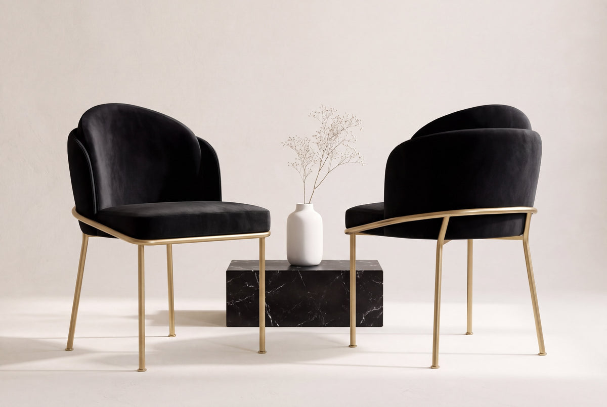 Two Alexander dining chairs in black velvet, front and back views, beside a black marble block