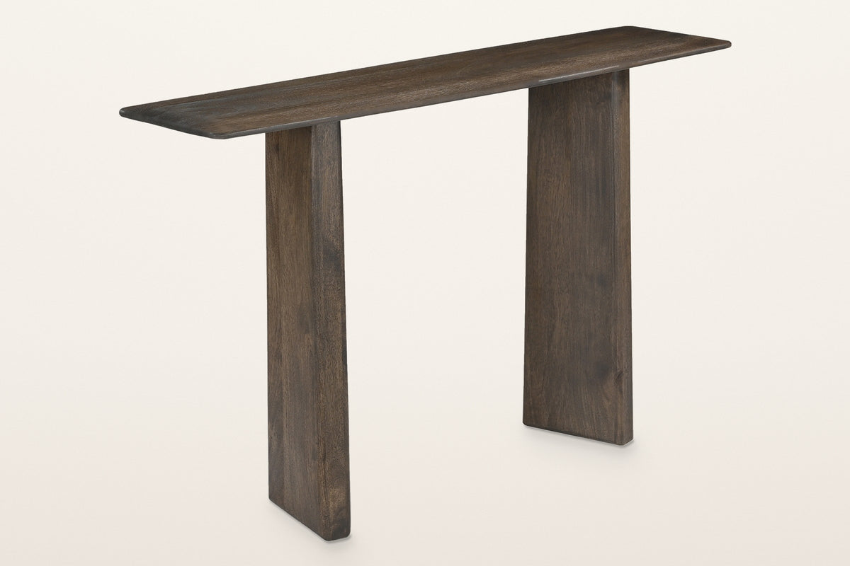 Anghiari slab leg console table in mocha, three-quarter view on a warm white studio backdrop