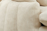 Close-up of a squared arm end and the plump vertical channels in beige chenille