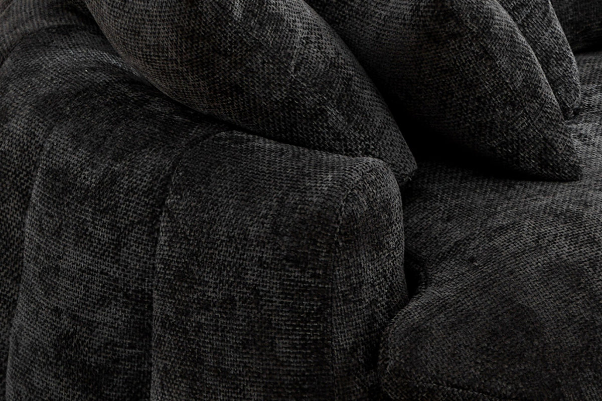 Close-up of a squared arm end and the plump vertical channels in black chenille