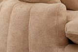 Close-up of a squared arm end and the plump vertical channels in coffee chenille