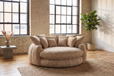 Aosta lounge chair on a jute rug in a Montreal loft with pale brick walls and steel factory windows (Coffee)